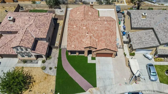 an aerial view of a house with outdoor space