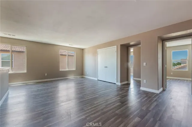 a utility room with cabinets washer and dryer