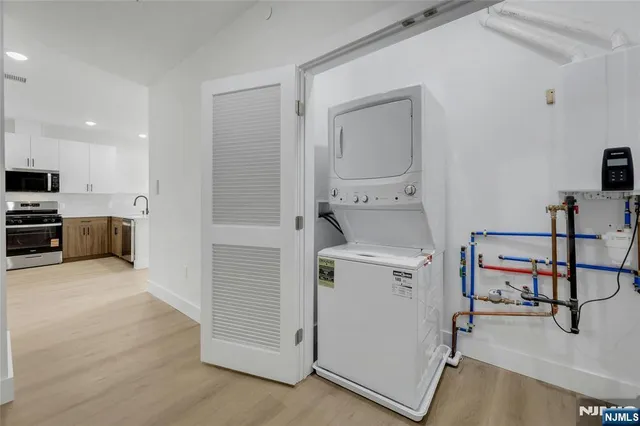 a view of kitchen with furniture and wooden floor