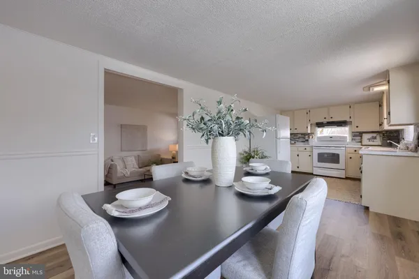 a kitchen with a table and chairs