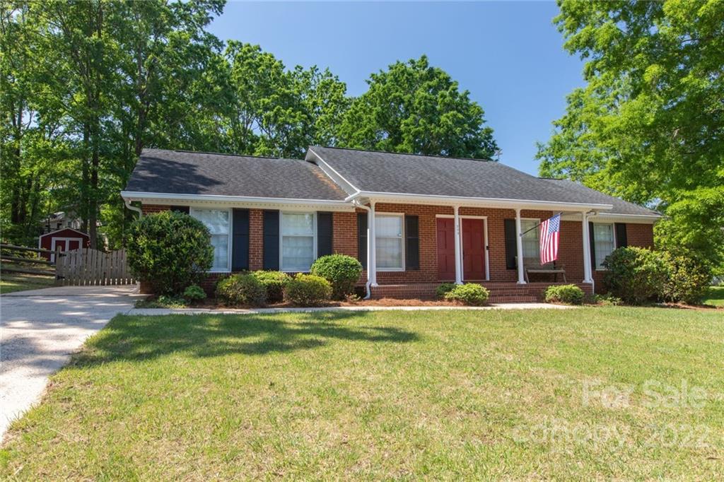 209 Fallingtree Lane Monroe, NC 28112 - Photo 1 of 22 a front view of a house with a yard