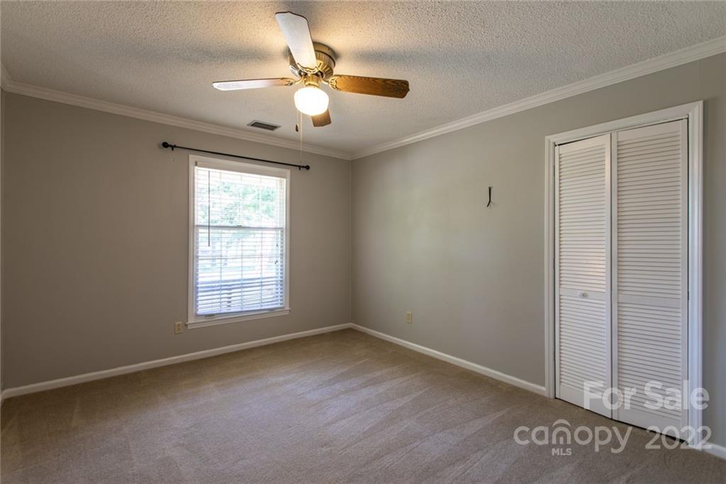 209 Fallingtree Lane Monroe, NC 28112 - Photo 13 of 22 an empty room with chandelier fan
