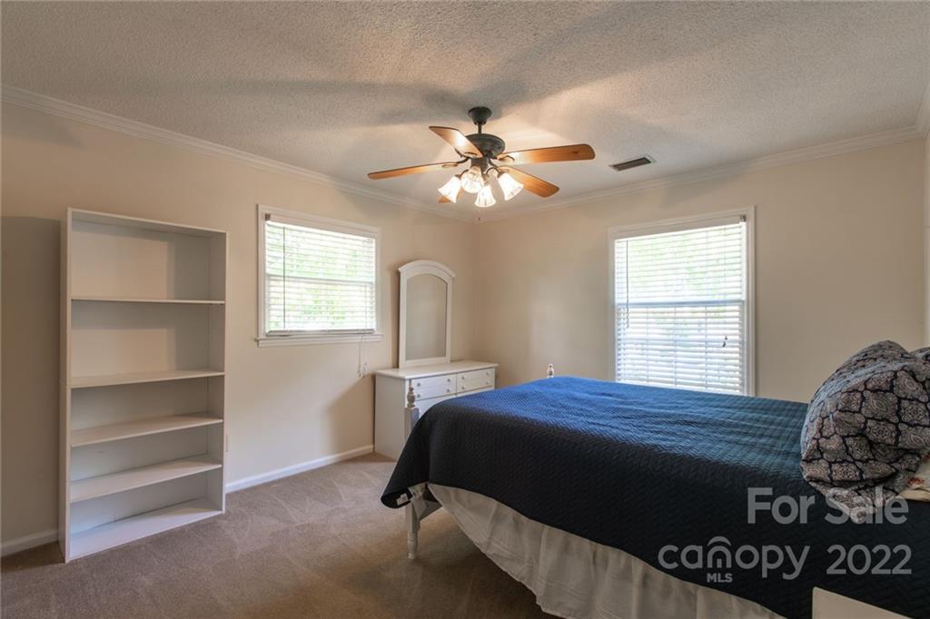 209 Fallingtree Lane Monroe, NC 28112 - Photo 14 of 22 a bedroom with a bed closet and a window