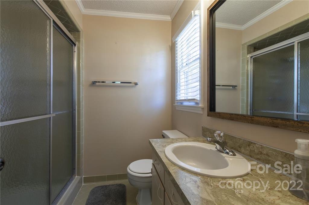 209 Fallingtree Lane Monroe, NC 28112 - Photo 16 of 22 a bathroom with a sink toilet and mirror