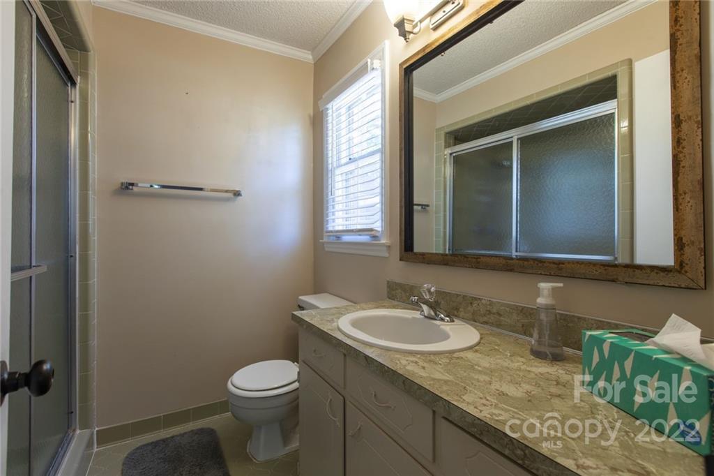 209 Fallingtree Lane Monroe, NC 28112 - Photo 17 of 22 a bathroom with a granite countertop sink toilet and mirror