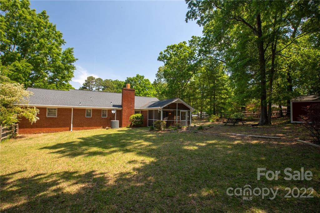 209 Fallingtree Lane Monroe, NC 28112 - Photo 20 of 22 a view of a yard in front of a house with a large tree