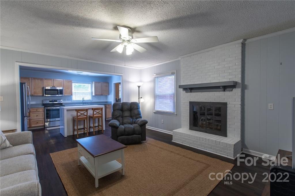 209 Fallingtree Lane Monroe, NC 28112 - Photo 7 of 22 a living room with furniture and a fireplace