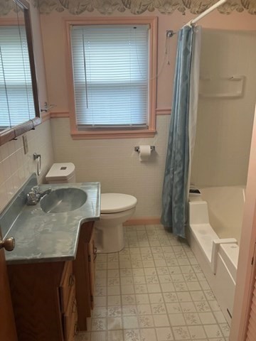 14 Birchwood Road Southwick, MA 01077 - Photo 21 of 25 a bathroom with a granite countertop sink a toilet and bathtub