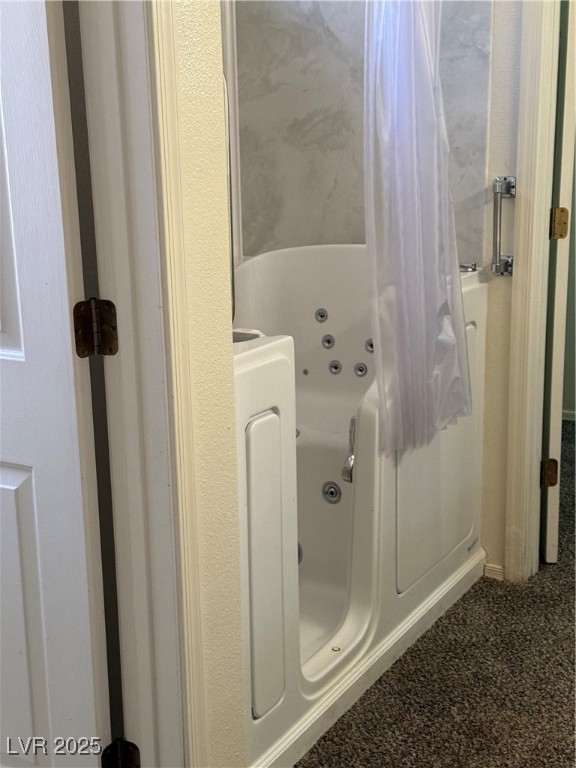 495 Edgefield Ridge Place Henderson, NV 89012 - Photo 12 of 16 Bathroom featuring a tub with jets and curtained shower