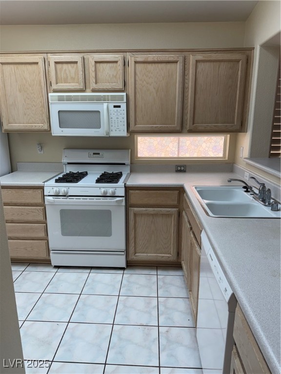 495 Edgefield Ridge Place Henderson, NV 89012 - Photo 2 of 16 Kitchen featuring range, dishwasher, light countertops, and light brown cabinets