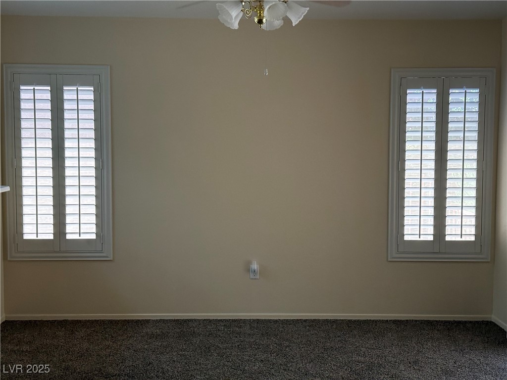 495 Edgefield Ridge Place Henderson, NV 89012 - Photo 5 of 16 Unfurnished room with a ceiling fan, plenty of natural light, and carpet floors