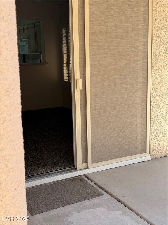 495 Edgefield Ridge Place Henderson, NV 89012 - Photo 9 of 16 Doorway to property featuring stucco siding