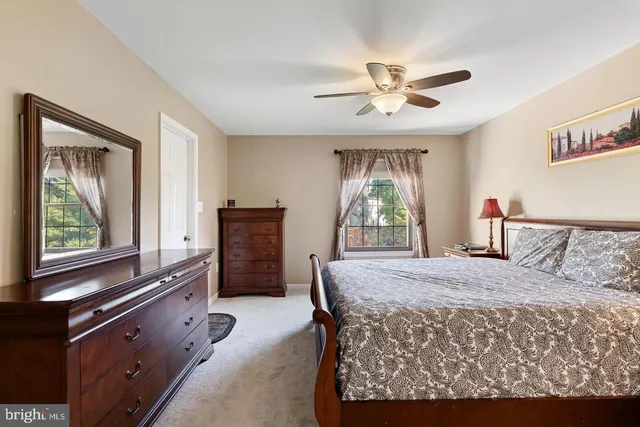 a bed room with a bed and a dresser