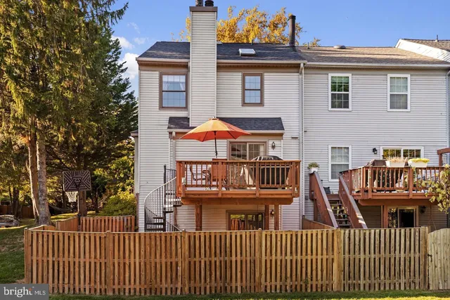 a view of a brick house with large windows
