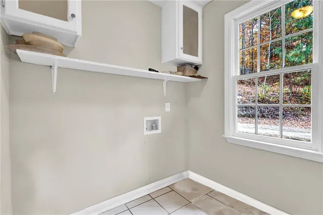 a view of a room with rack on the wall and a window