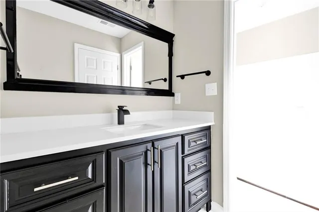 a close view of a sink and a mirror