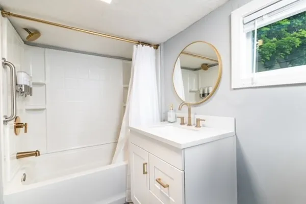 a bathroom with a sink and a mirror
