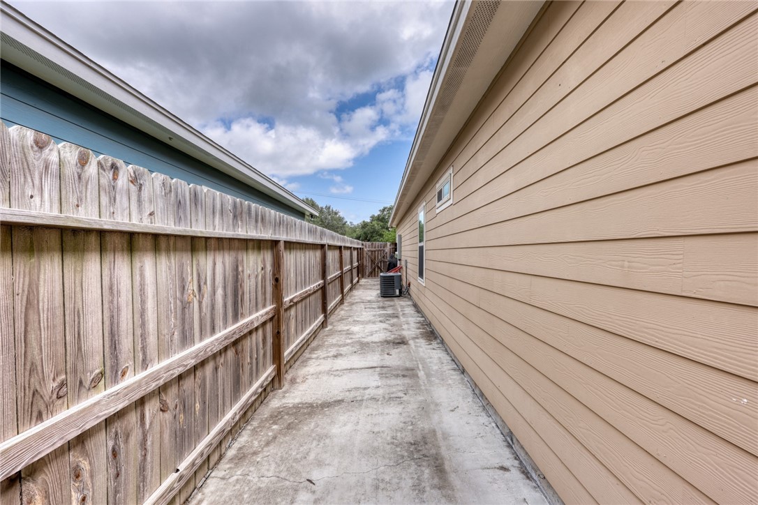 302 Cooper Road, Unit E2 Odem, TX 78370 - Photo 21 of 24 a view of balcony with wooden floor