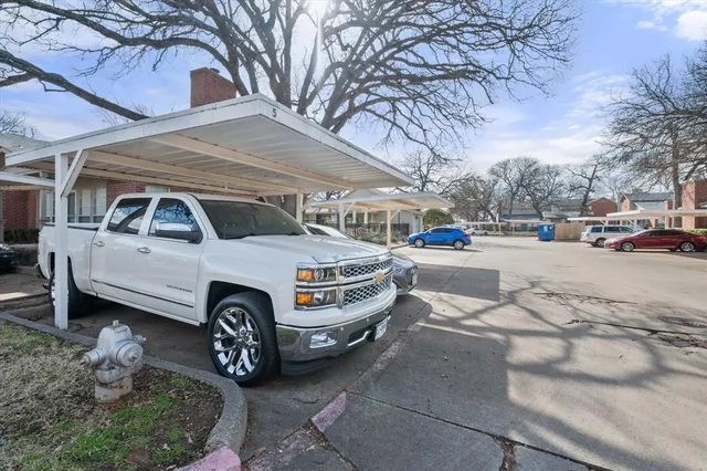 a front view of a house with parking space