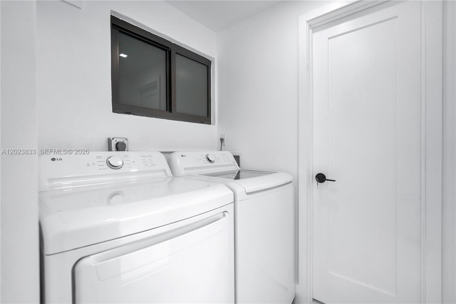 6566 Southwest 35th Street Miami, FL 33155 - Photo 14 of 36 a utility room with dryer and washer