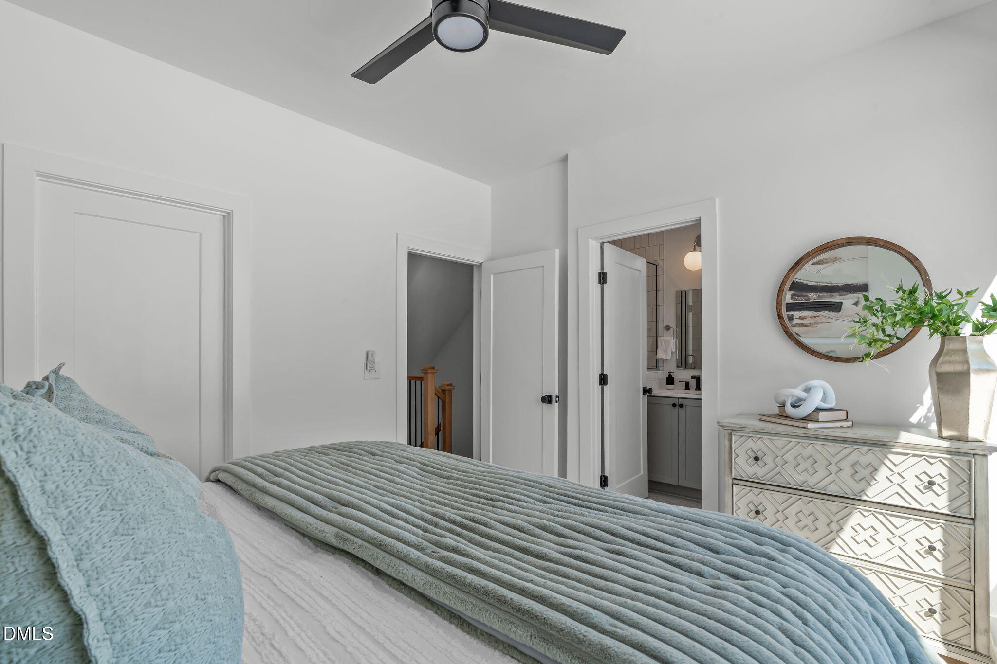 2010 Moody Durham, NC 27701 - Photo 24 of 45 a bedroom with a bed and a mirror on the dresser