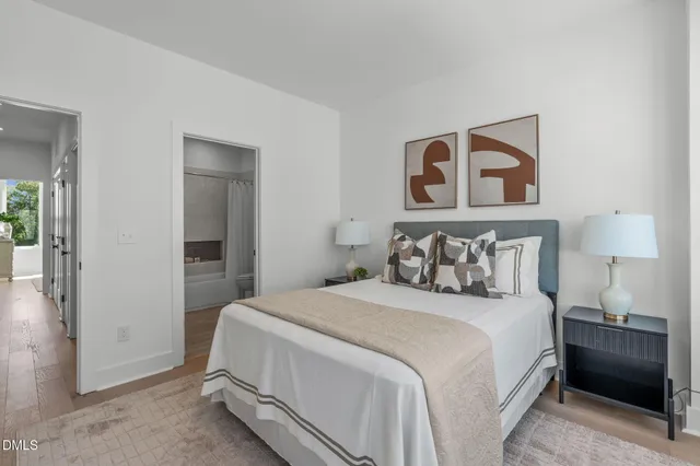 a bedroom with a bed and a lamp