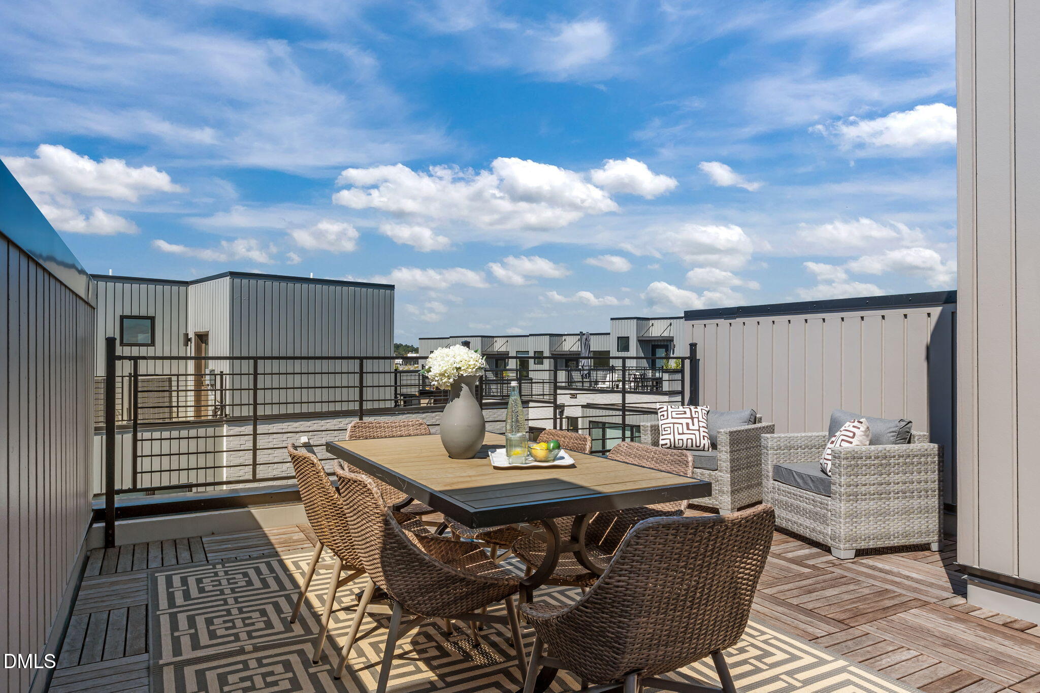 2010 Moody Durham, NC 27701 - Photo 5 of 45 a view of a roof deck with table and chairs with wooden floor and fence