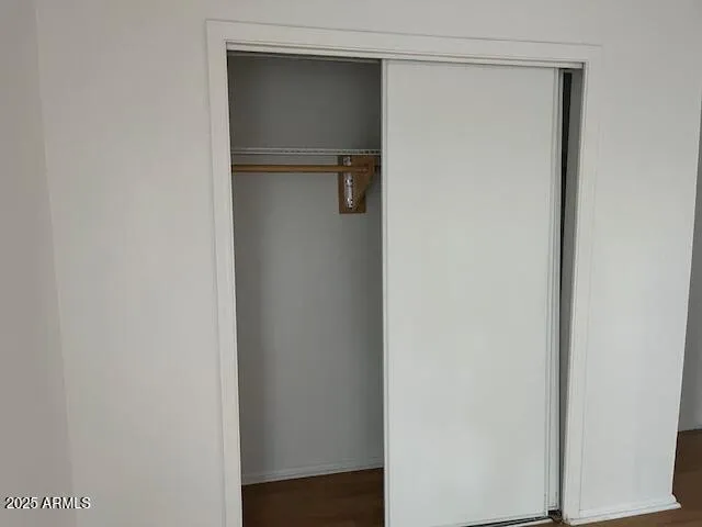 a white toilet sitting next to a bath tub