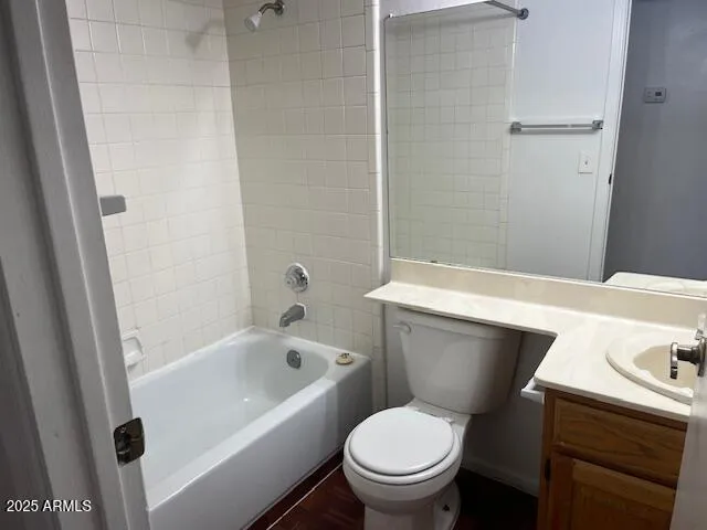 a view of a house with wooden fence and two windows