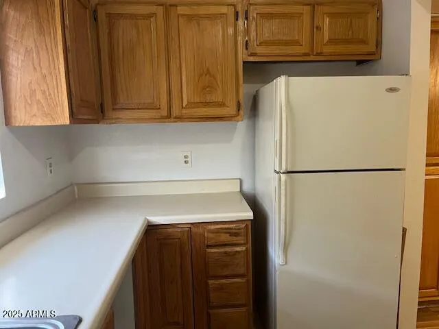 a stove top oven sitting inside of a kitchen