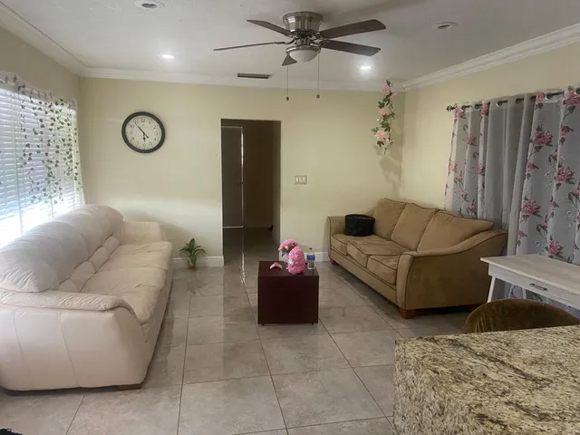 a living room with furniture and a table
