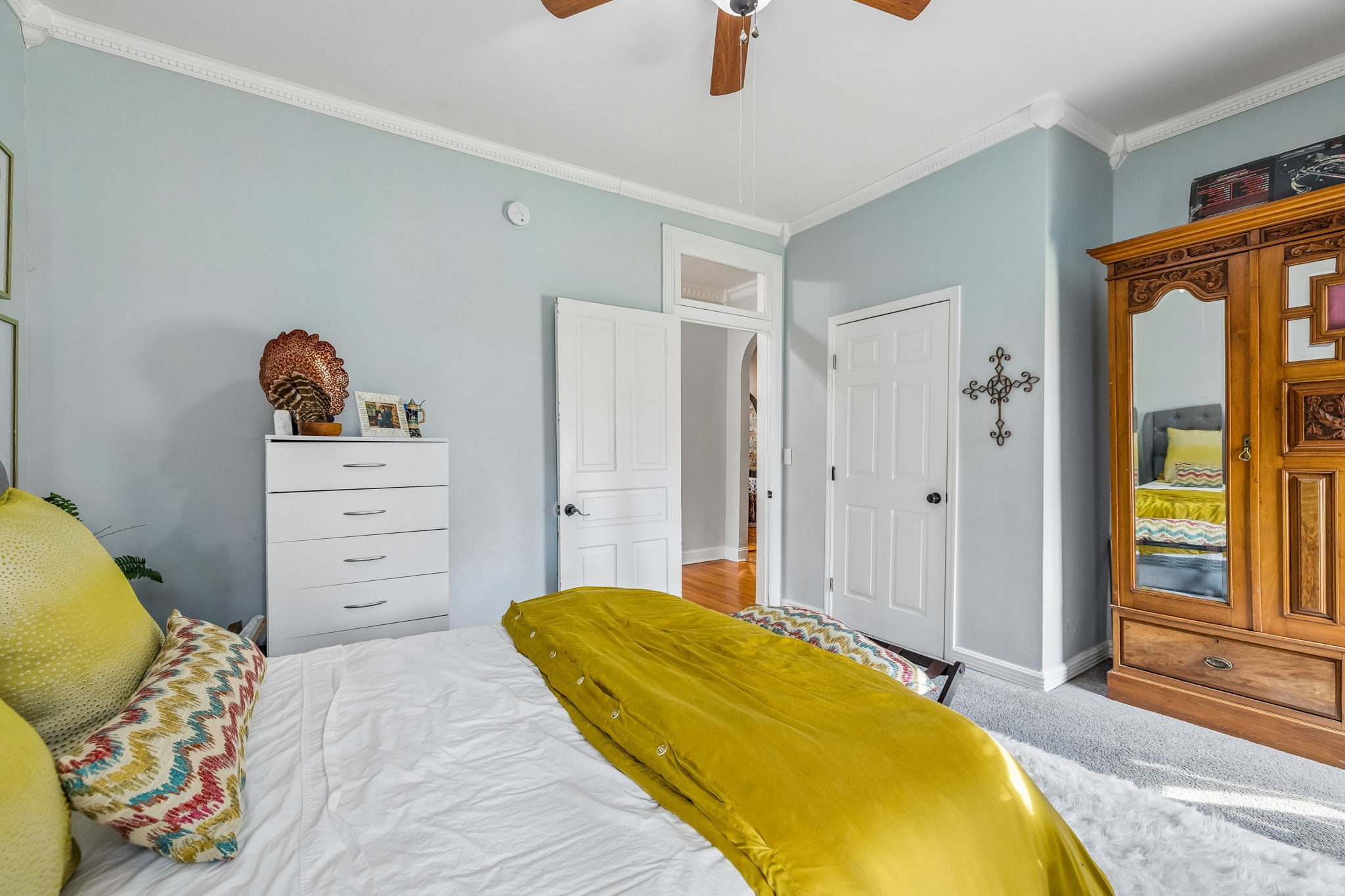 500 5th Avenue East Springfield, TN 37172 - Photo 21 of 45 a bedroom with a bed and a chandelier