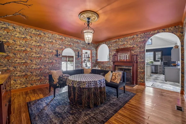 a view of a dining room with furniture and wooden floor