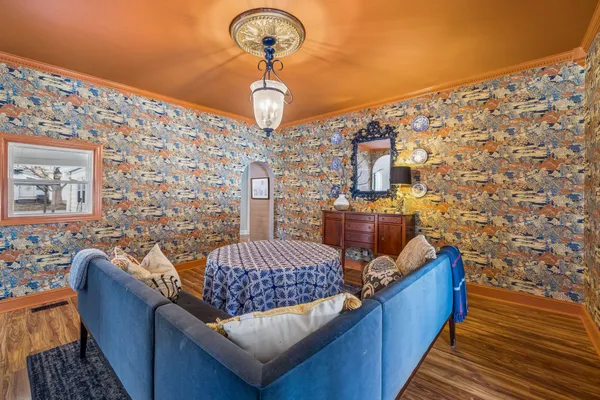 a living room with a couch and chandelier