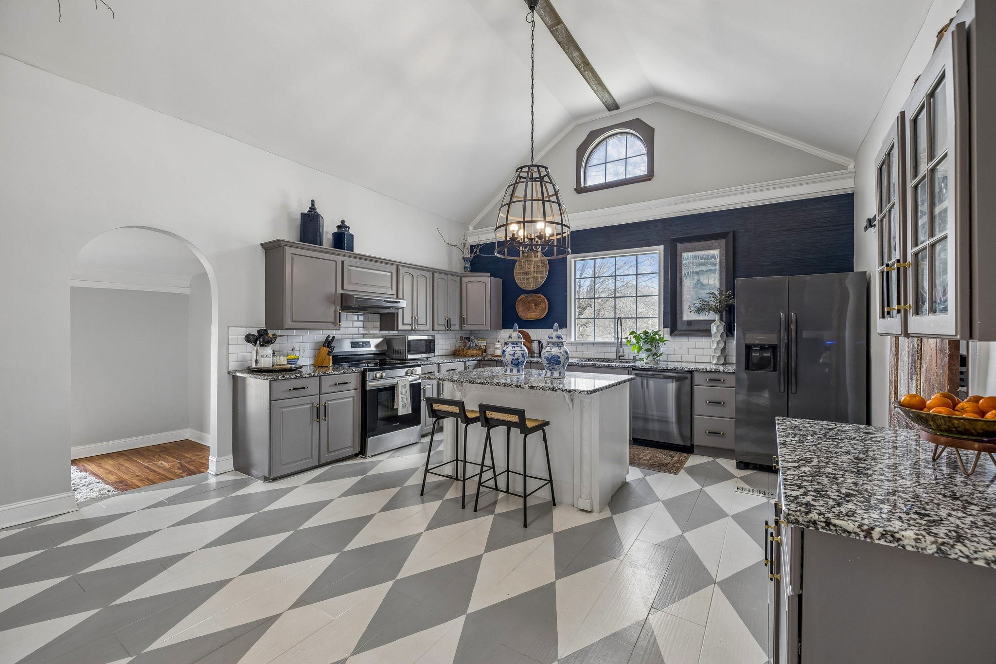500 5th Avenue East Springfield, TN 37172 - Photo 29 of 45 a kitchen with stainless steel appliances a stove a sink cabinets and a counter top space