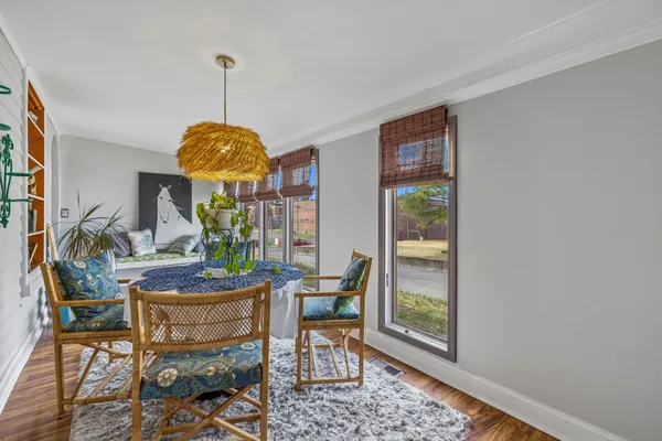 a view of a dining room with furniture window and outside view
