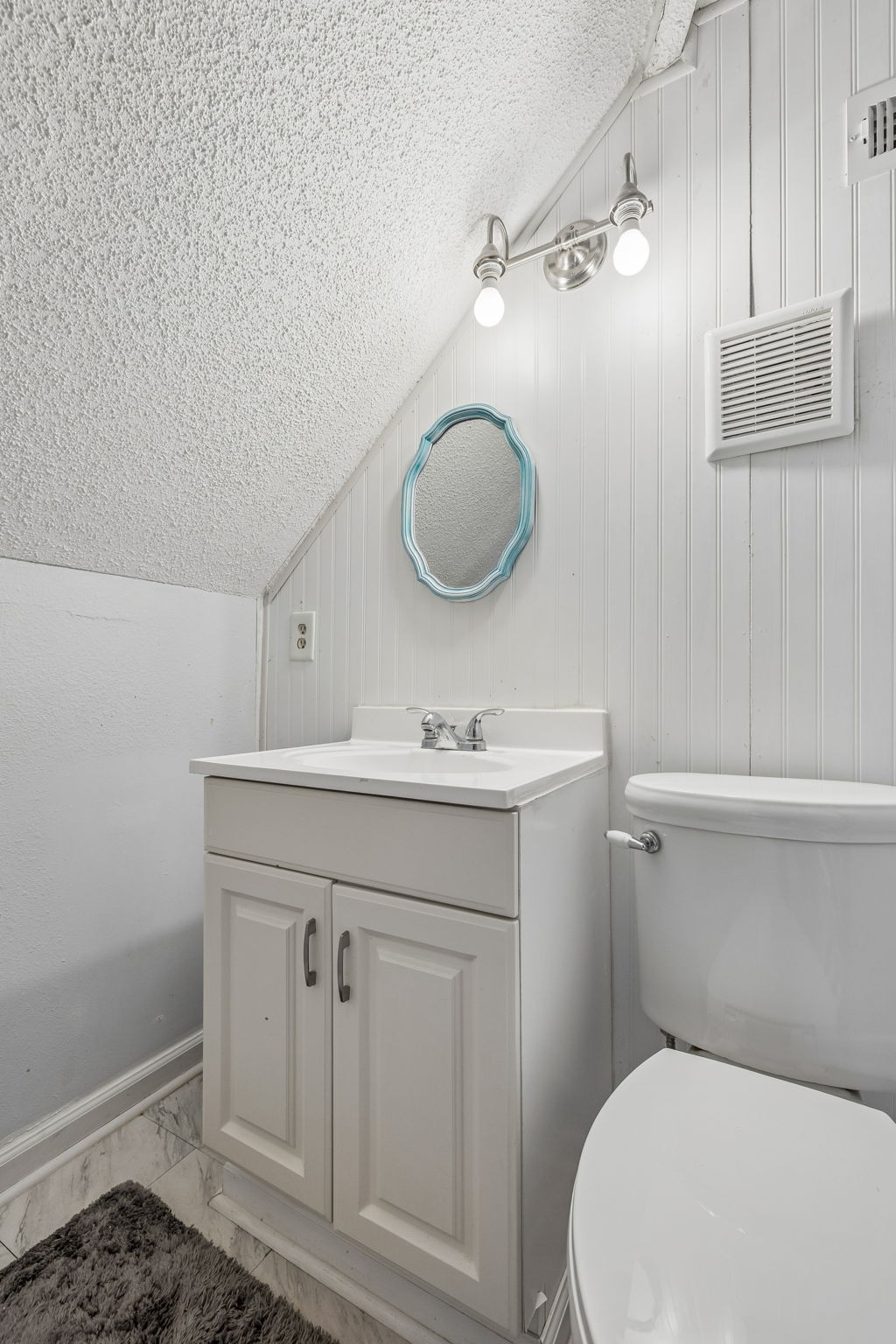 500 5th Avenue East Springfield, TN 37172 - Photo 40 of 45 a bathroom with a toilet a sink and mirror