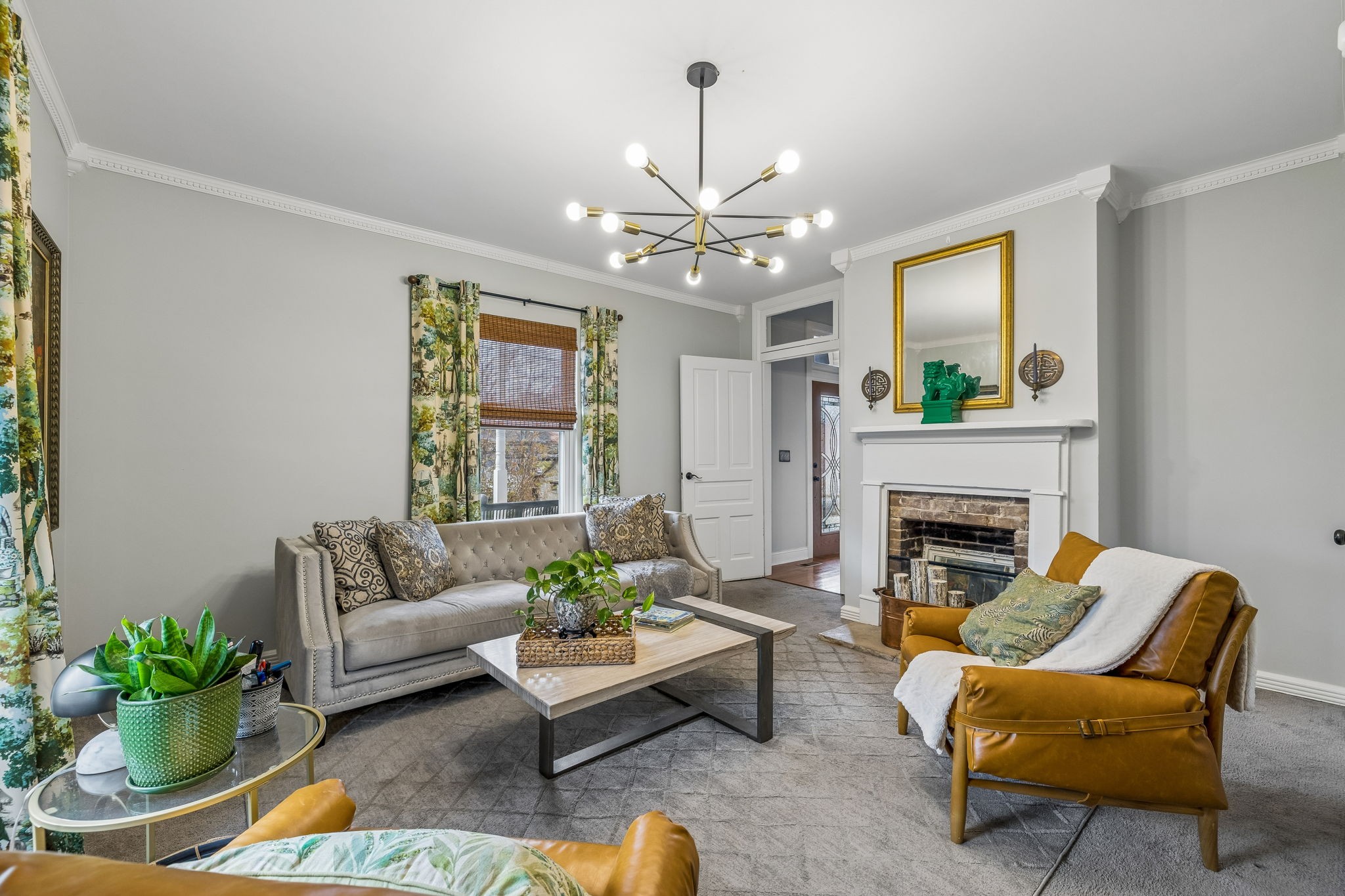 500 5th Avenue East Springfield, TN 37172 - Photo 6 of 45 a living room with furniture a chandelier and a fireplace