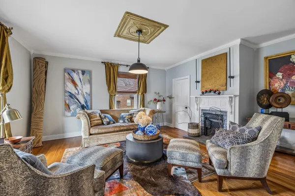 a living room with fireplace furniture and a flat screen tv