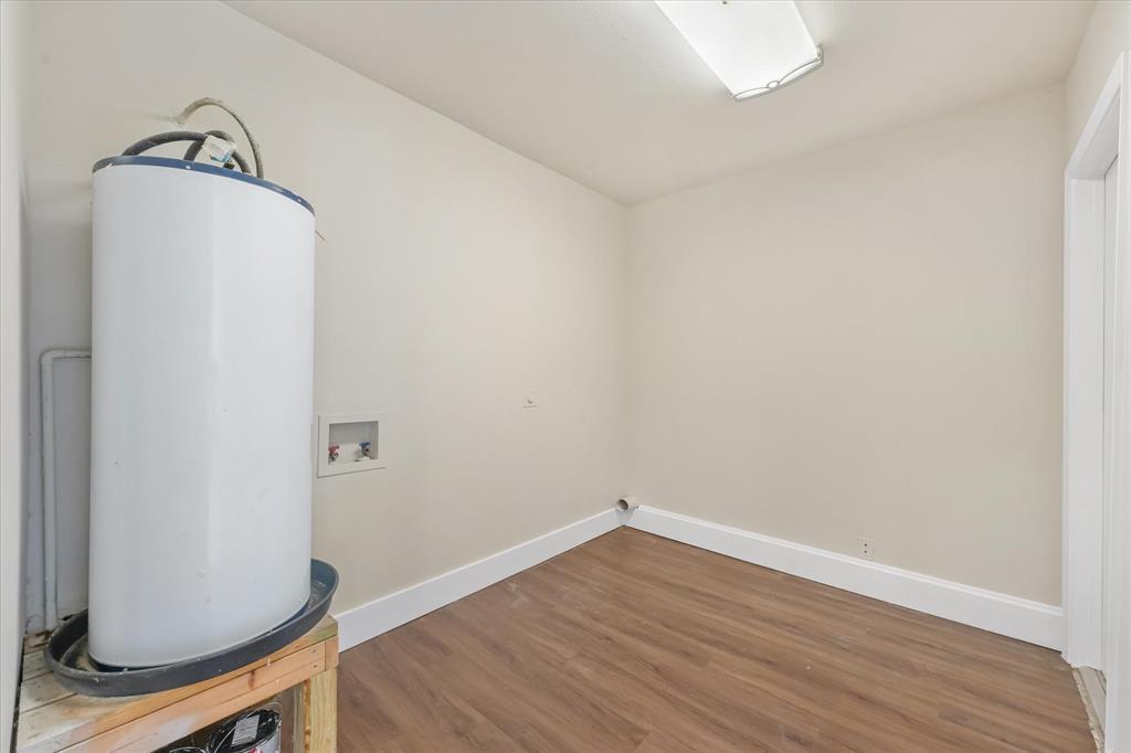 304 East Stone Road Wylie, TX 75098 - Photo 15 of 19 a view of a small space with wooden floor and a window