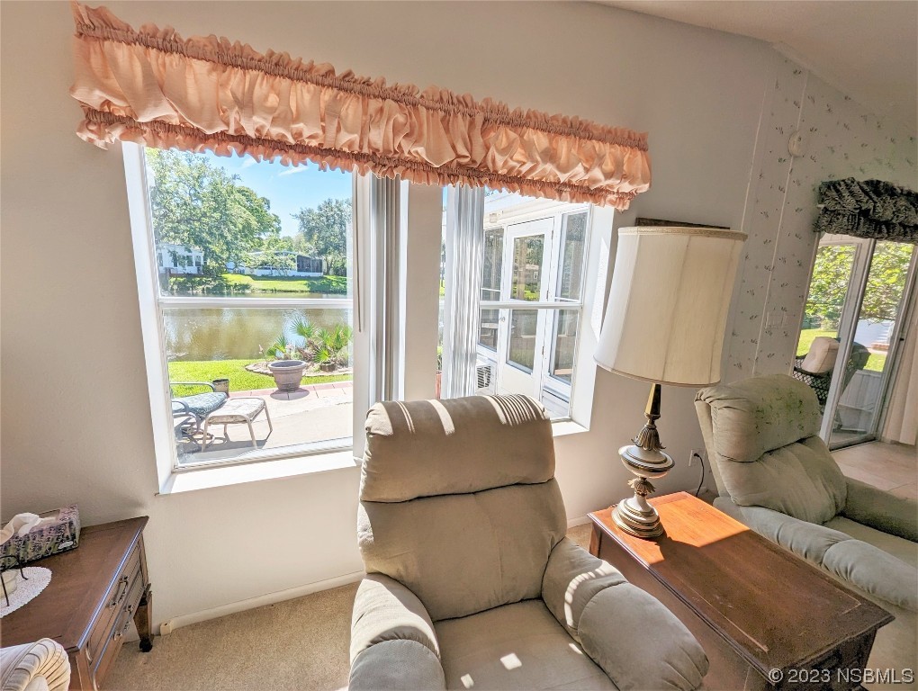 708 Navigators Way Edgewater, FL 32141 - Photo 19 of 26 a living room with furniture and a window