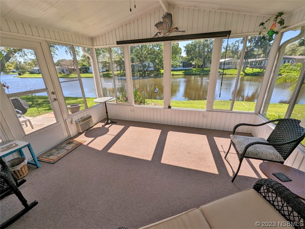 708 Navigators Way Edgewater, FL 32141 - Photo 2 of 26 a living room with large windows and a table