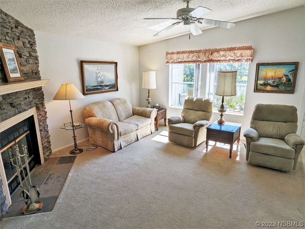 708 Navigators Way Edgewater, FL 32141 - Photo 3 of 26 a living room with furniture and a fireplace