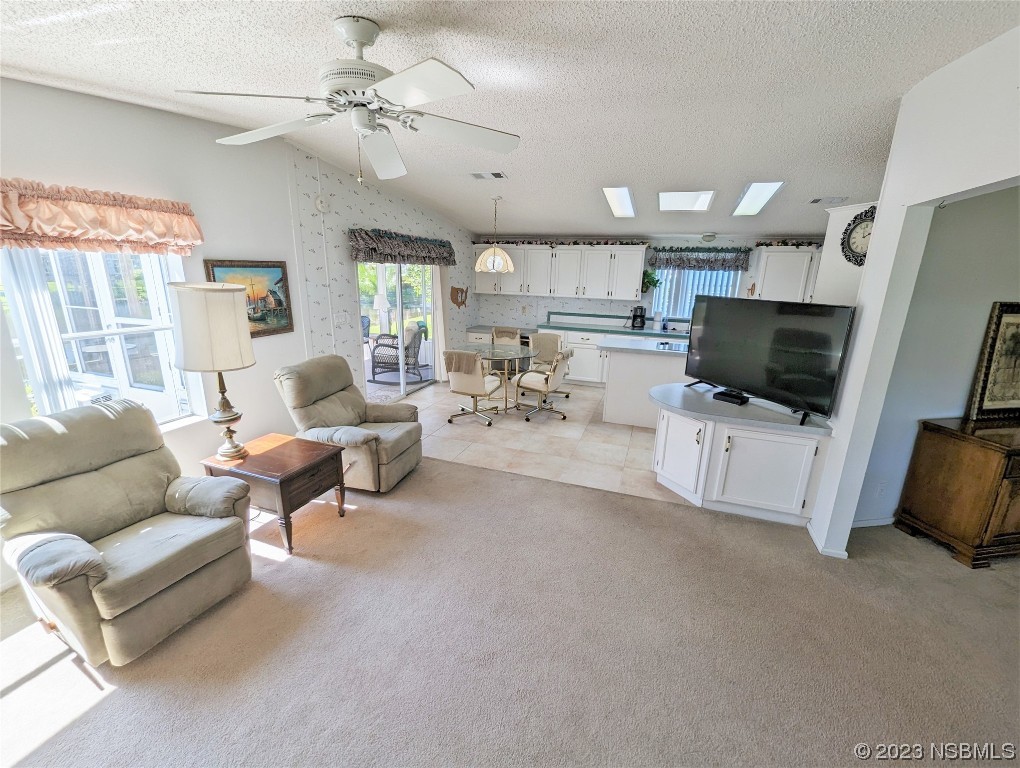 708 Navigators Way Edgewater, FL 32141 - Photo 4 of 26 a living room with furniture and a flat screen tv