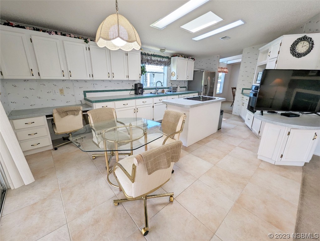 708 Navigators Way Edgewater, FL 32141 - Photo 5 of 26 a living room with furniture and a flat screen tv