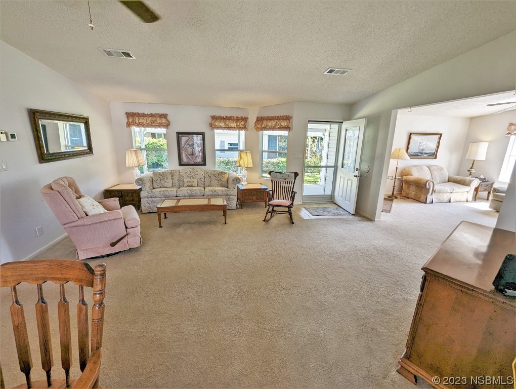 708 Navigators Way Edgewater, FL 32141 - Photo 9 of 26 a living room with furniture and a large window