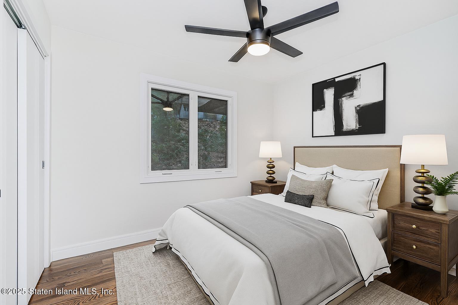 113 Longview Road Staten Island, NY 10304 - Photo 14 of 35 a bedroom with a bed and a window