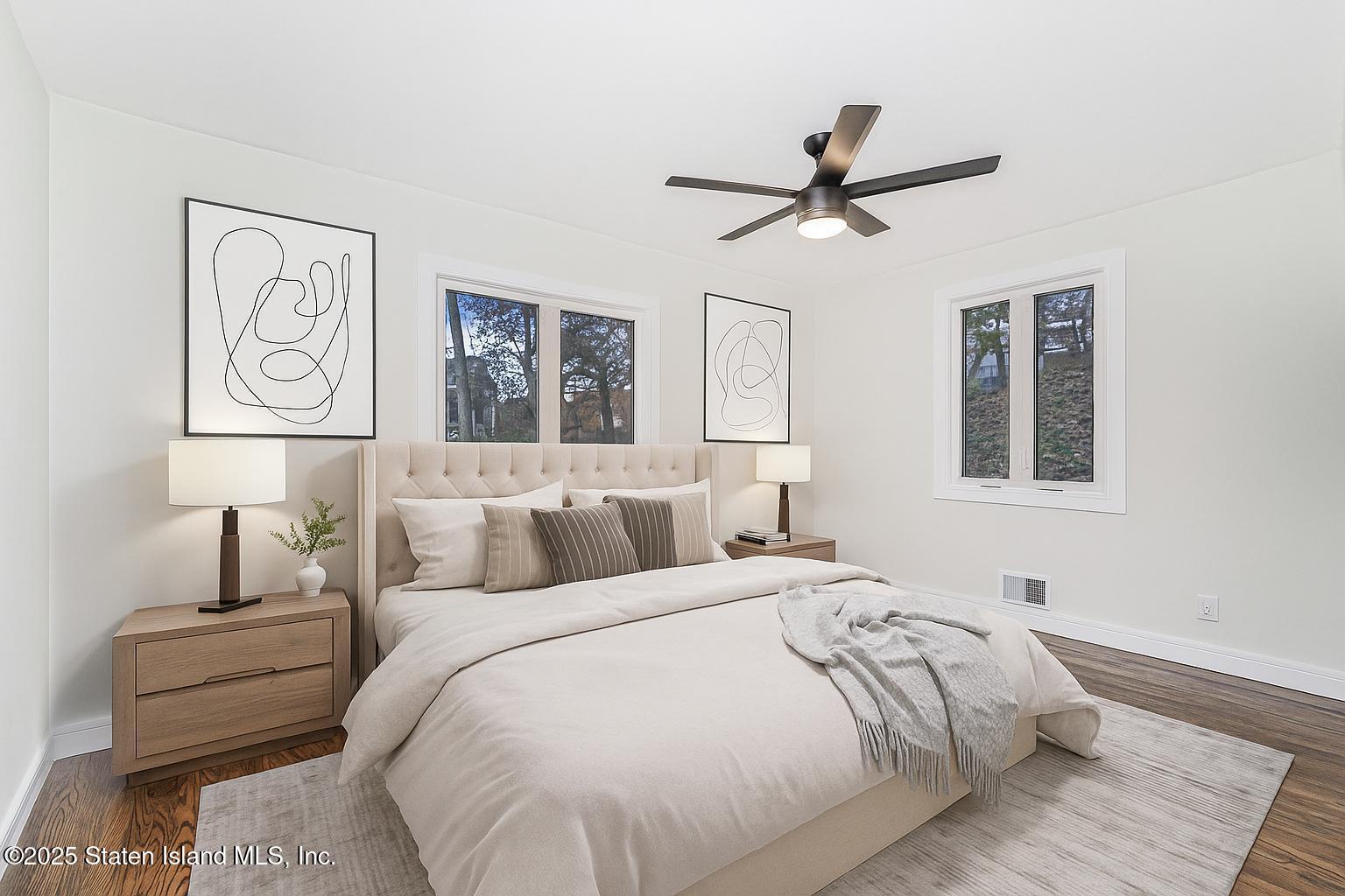 113 Longview Road Staten Island, NY 10304 - Photo 15 of 35 a bedroom with a bed and painting on the wall