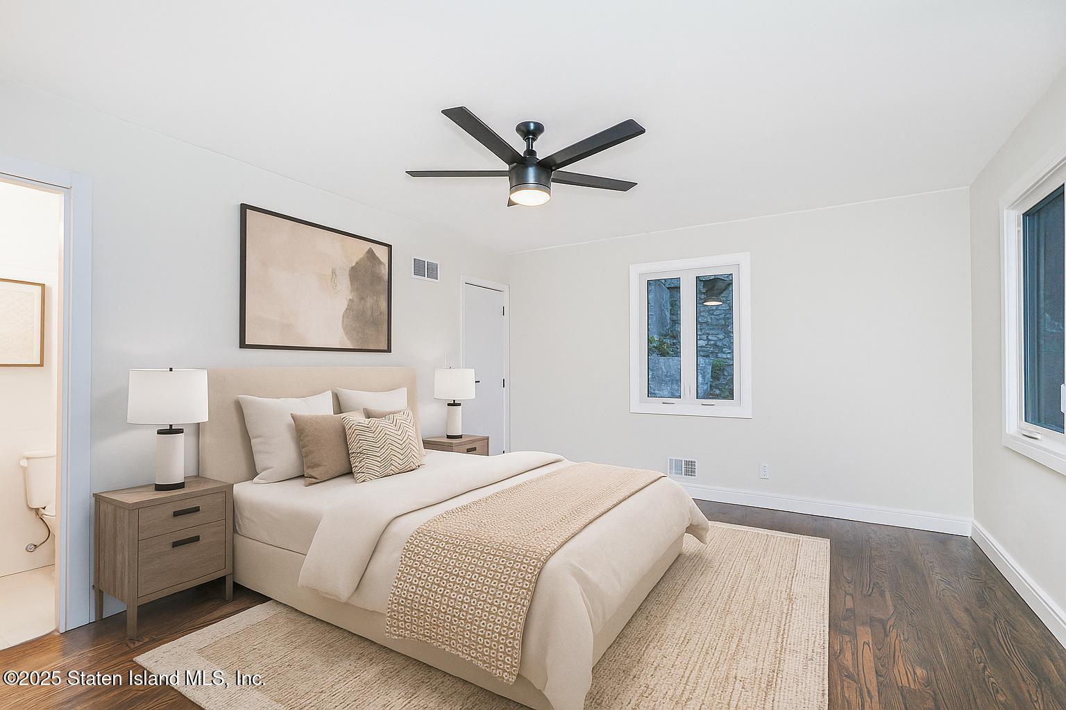 113 Longview Road Staten Island, NY 10304 - Photo 16 of 35 a bedroom with a large bed and a window