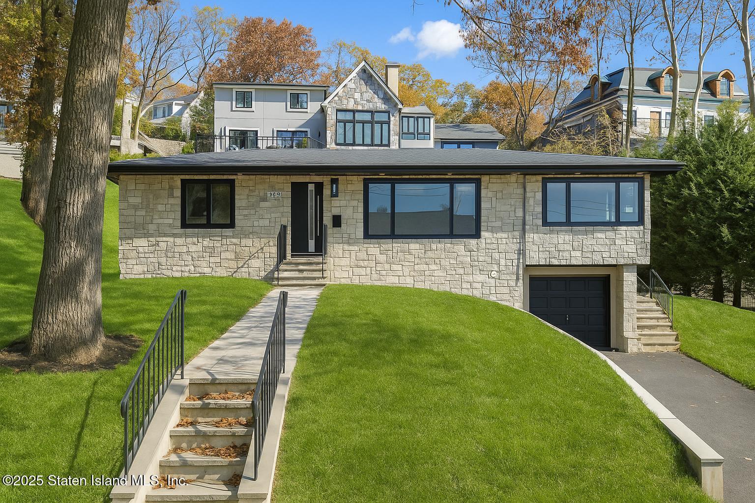 113 Longview Road Staten Island, NY 10304 - Photo 2 of 35 a front view of a house with a yard